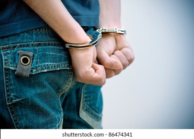 Young Man In Handcuffs