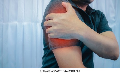 A Young Man Has An Injury To His Arm. Muscle Pain