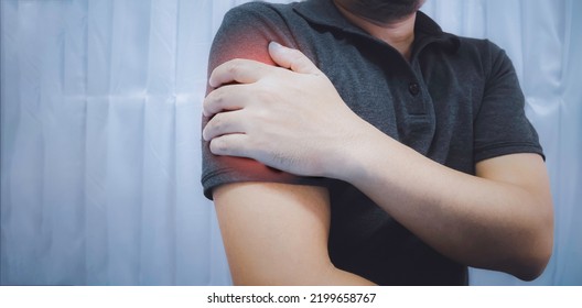 A Young Man Has An Injury To His Arm. Muscle Pain