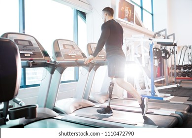 Young man has a rehabilitation. He is training on treadmill - Powered by Shutterstock