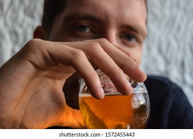 Young Man Having Beers In The Afternoon In A Bar Inside A Cave In Autumn