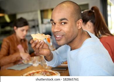 Young Man Having Eating Pizza Slice 