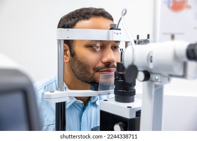 Young man having an examination in a ophtalmological clinic - Shutterstock ID 2244338711