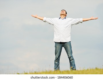 Young Man Having Happy Time In Nature With Copy Space