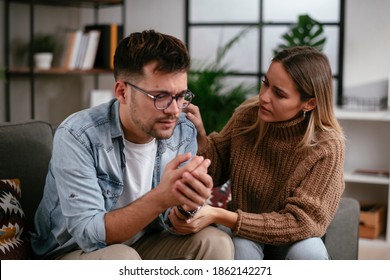 Young Man Having A Problem. Girlfriend Comforting Her Sad Boyfriend.