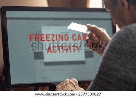 Young man having problems with online card payment, closeup photo. Man frustrated, staring at computer monitor with account freeze and blocking alert