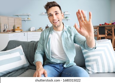 Young man having video call at home - Powered by Shutterstock