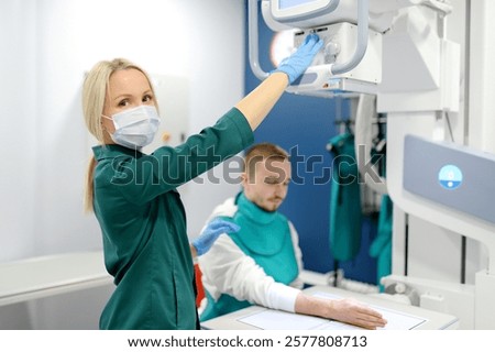 Similar – Image, Stock Photo Young man having x-ray shot of broken hand in x ray room in modern clinic. Patient wearing in protect lead apron