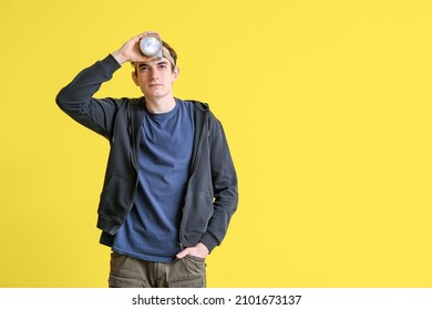 Young Man With Headlamp Flashlight On Yellow Background
