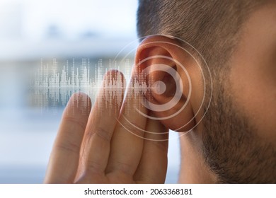 Young Man With Hearing Problems Or Hearing Loss. Hearing Test Concept.