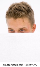 Young Man Hiding Himself Behind A White Towel