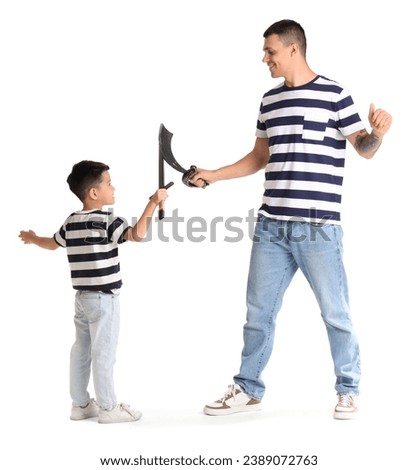 Young man and his little son playing with toy swords on white background