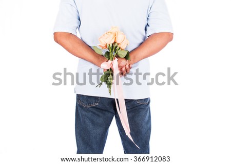 Similar – Man in jeans and plaid shirt with some white flowers in his hand