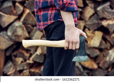 Young Man Holding An Axe.