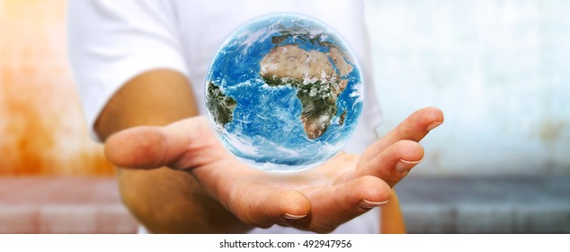 Young man holding the blue planet earth in his hand 3D rendering elements of this image furnished by NASA