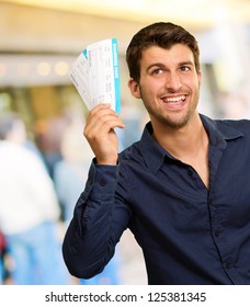 Young Man Holding Boarding Pass, Outdoors