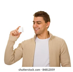 Young Man Holding A Bottle Of Medicine