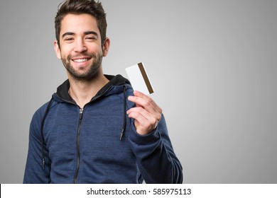 Young Man Holding A Credit Card