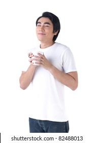 A Young Man Holding A Cup Of Coffee And Happy With Coffee Smell