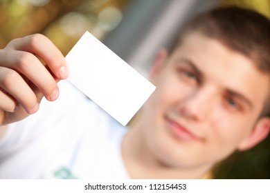 Young Man Holding Empty Business Card