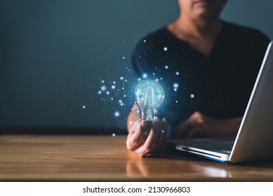 Young Man Holding Glowing Lightbulb With Drawing Brain And Connection Line, Creative Thinking Ideas And Innovation Concept.