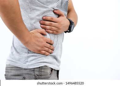 Young Man Holding His Belly, Liver Pain, Kidney Isolated Over White Background.