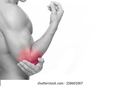 Young Man Holding His Elbow In Pain, Isolated On White Background