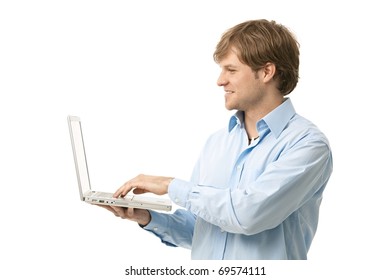 Young Man Holding Laptop Computer In Hand, Typing. Side View, Cutout.?