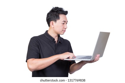 Young Man Holding Laptop Looking Screen Wearing Black Polo Shirt Uniform Isolated On White Background