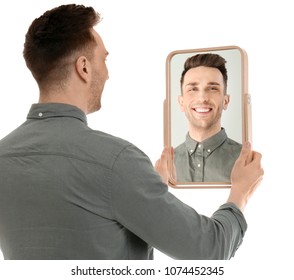 Young Man Holding Mirror Looking Himself Stock Photo (Edit Now) 1074452345