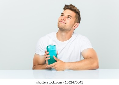 Young Man Holding Mouthwash Smiling Confident Stock Photo 1562475841 