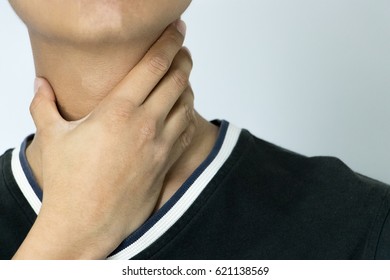 Young Man Holding The Neck. Sore Throat Young Man.