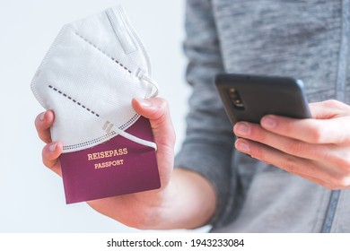 Young Man Is Holding A Passport, Ffp2 Mask And Smartphone On The Airport, “Reisepass Passport”