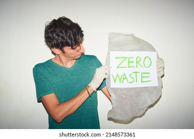 Young Man Holding Plastic Bag With 