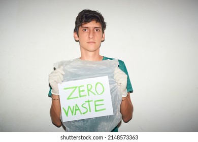 Young Man Holding Plastic Bag With 