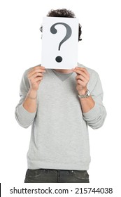 Young Man Holding Question Mark Sign Isolated On White Background