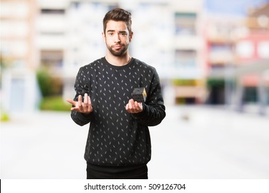 Young Man Holding A Rubik Cube