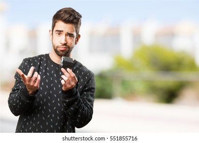 Young Man Holding A Rubik Cube