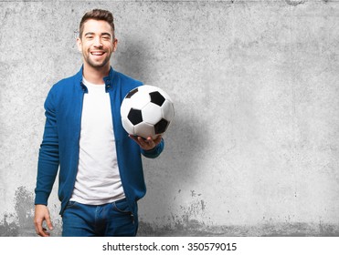 Young Man Holding A Soccer Ball