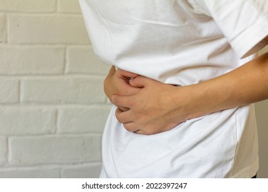 Young Man Holds His Stomach His Stock Photo 2022397247 | Shutterstock