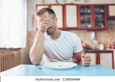 Young Man At Home On A Healthy Diet