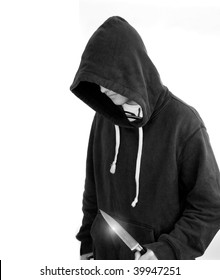 A Young Man In A Hoodie Holding A Knife Symbolizing Youth Crime