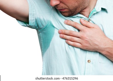 Young Man In Horror Looking At The Sweaty Shirt