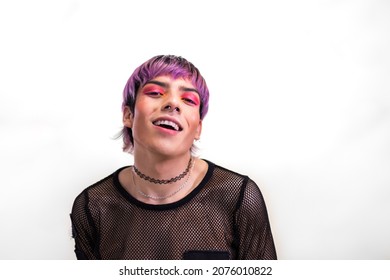 Young Man With Hot Pink Eye Make Up And Purple Hair With Cool Attitude Looking At Camera. Copy Space.