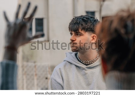 young man huffing and puffing, enduring the reprimand or argument