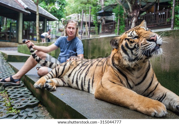 Young Man Hugging Big Tiger Thailand Stock Photo (Edit Now) 315044777