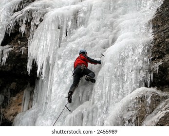 Young Man, Ice Climbing An Attractive Route.