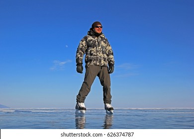 Young Man Ice Skating Outdoors On A Lake Baikal