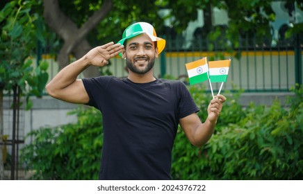 Young Man With Indian Flag Or Tricolour Doing Salute 