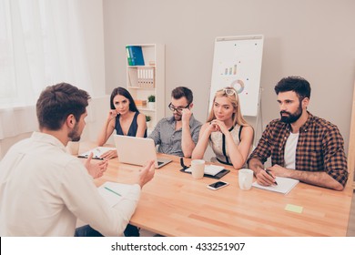 the young man is interviewed in order to get a job